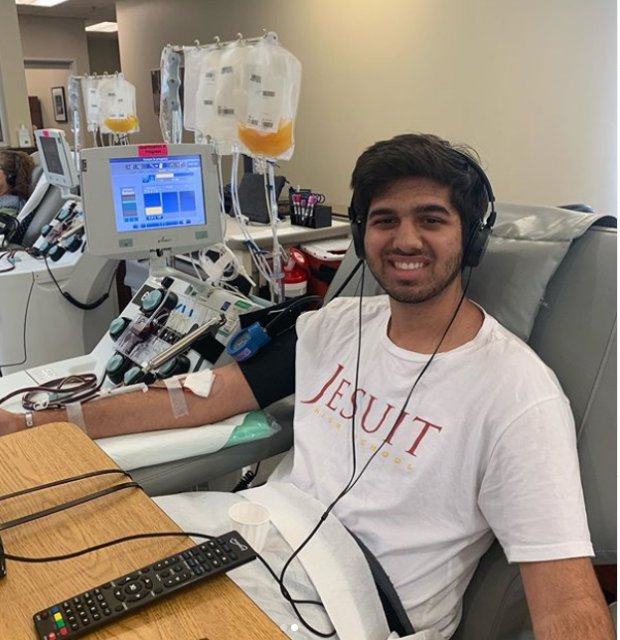 Dev in chair while giving blood.