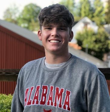 Sands smiling in college sweatshirt