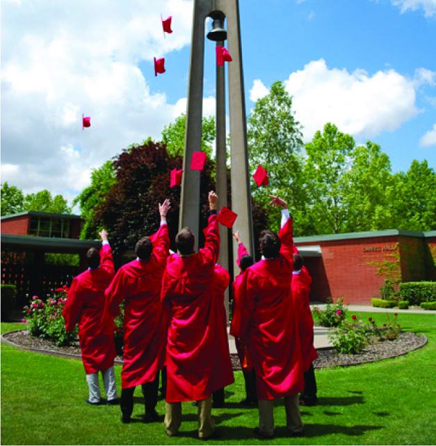 Students tossing caps around the bell tower.