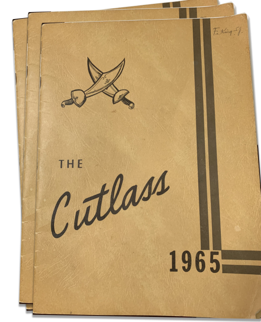 image of stack of old Cutlass yearbooks