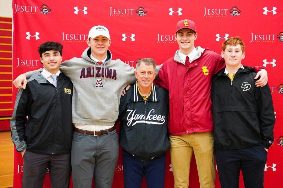 From left to right, infielder Luke Williams '20, catcher Daniel Susac '20, Varsity Baseball Head Coach Mr. Joe Potulny '76, and pitchers — Charlie Hurley '20 and Chris Baytosh '20 at Jesuit's National Signing Day in the Fr. Barry Gymnasium on Wednesday Feb. 5, 2020.