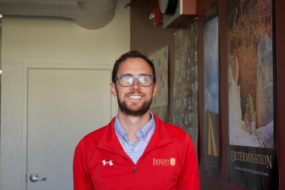 Head shot of Mr. Ferrari smiling in a classroom.