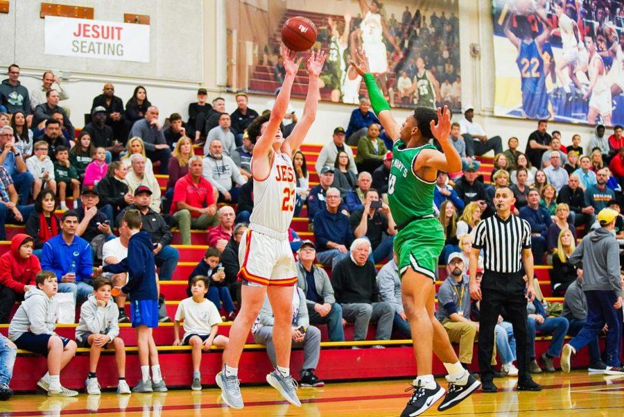 Jesuit Forward Matt Hoffman shoots three-point shot in game against St. Mary's High School in the Fr. Barry Gymnasium at Jesuit High School on Tuesday, Feb. 25.