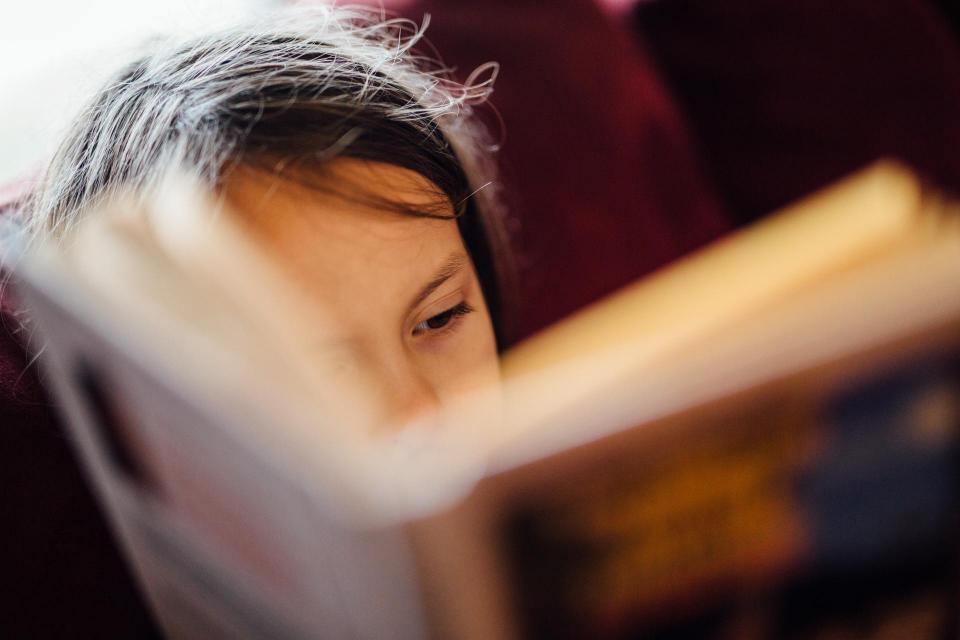 Closeup of child reading a book