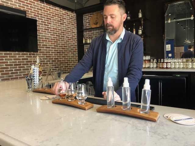 One of the owners in an empty tasting room