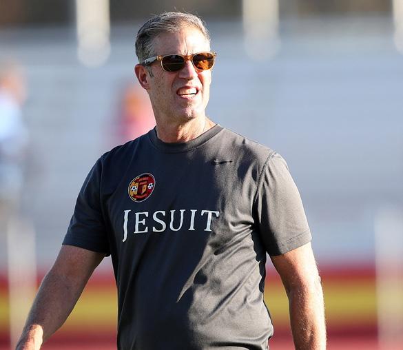 Rose on soccer field wearing sunglasses