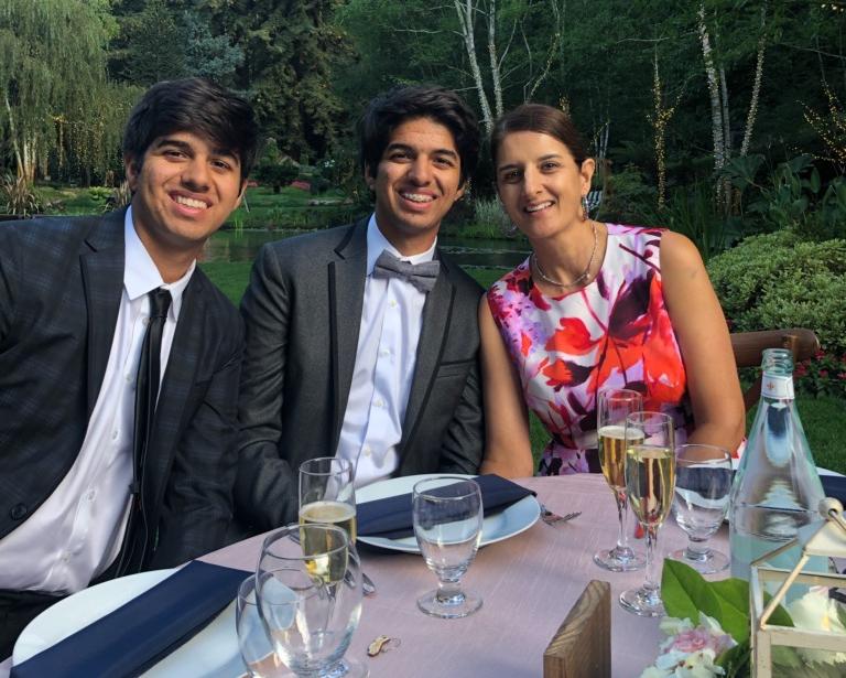 Shokar family sitting outside at a table.