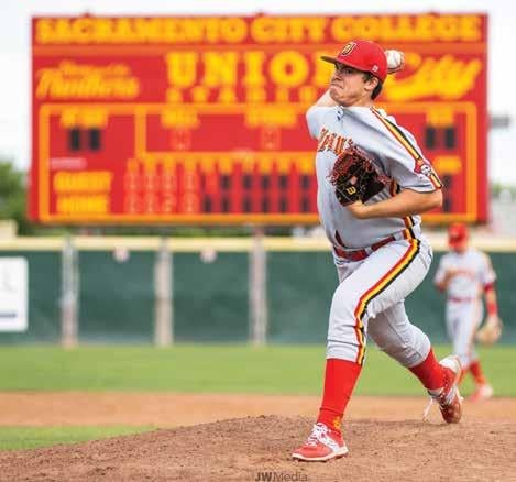 Susac on the pitchers mound, mid-throw.