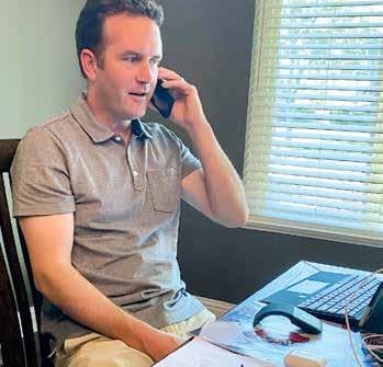Image of Principal Wood on phone