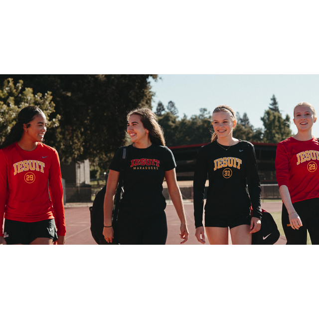 teen girls walking school track in athletic attire