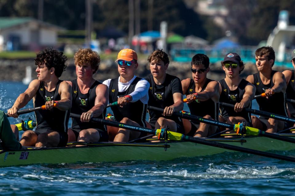 boat on water full of rowers