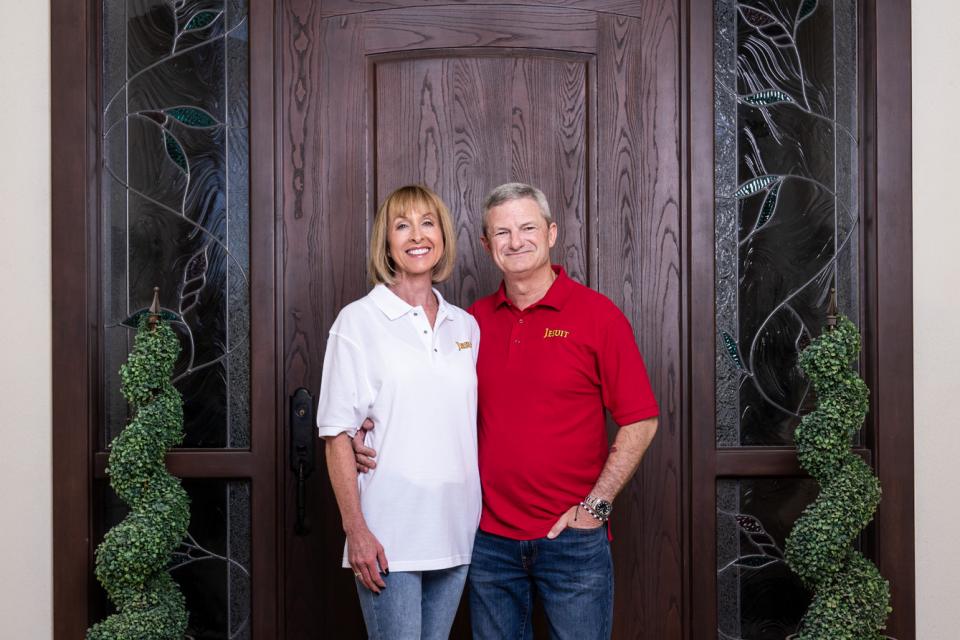 Image of Tim and Mary Frances Jeffries smiling in front of a stately door