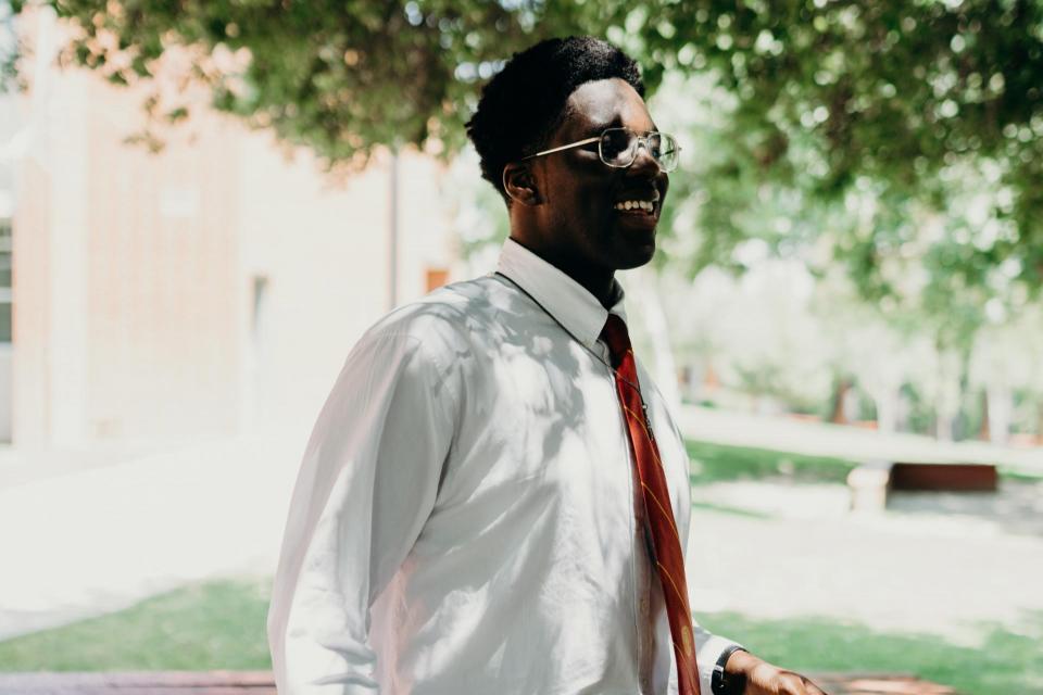 Candid shot of Obinna walking on campus