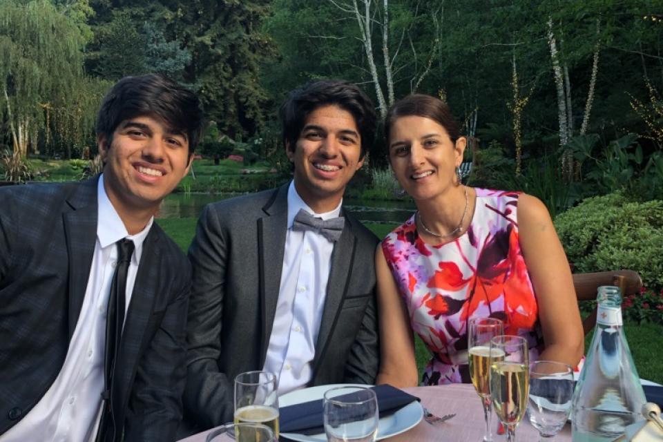 Shokar family sitting outside at a table.