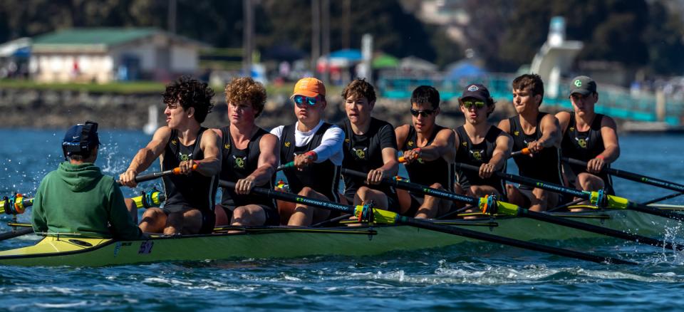 boat on water full of rowers
