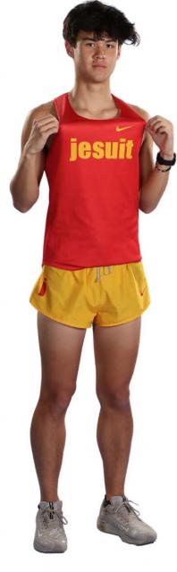 Preston proudly wearing team uniform smiling at camera