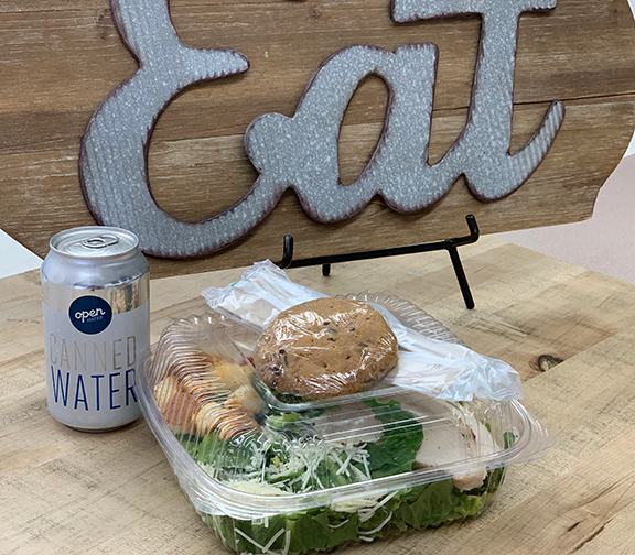 image of salad, cookie and water from cafe