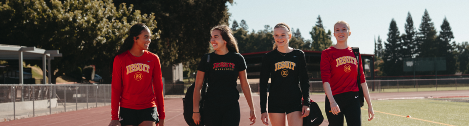 teen girls walking school track in athletic attire