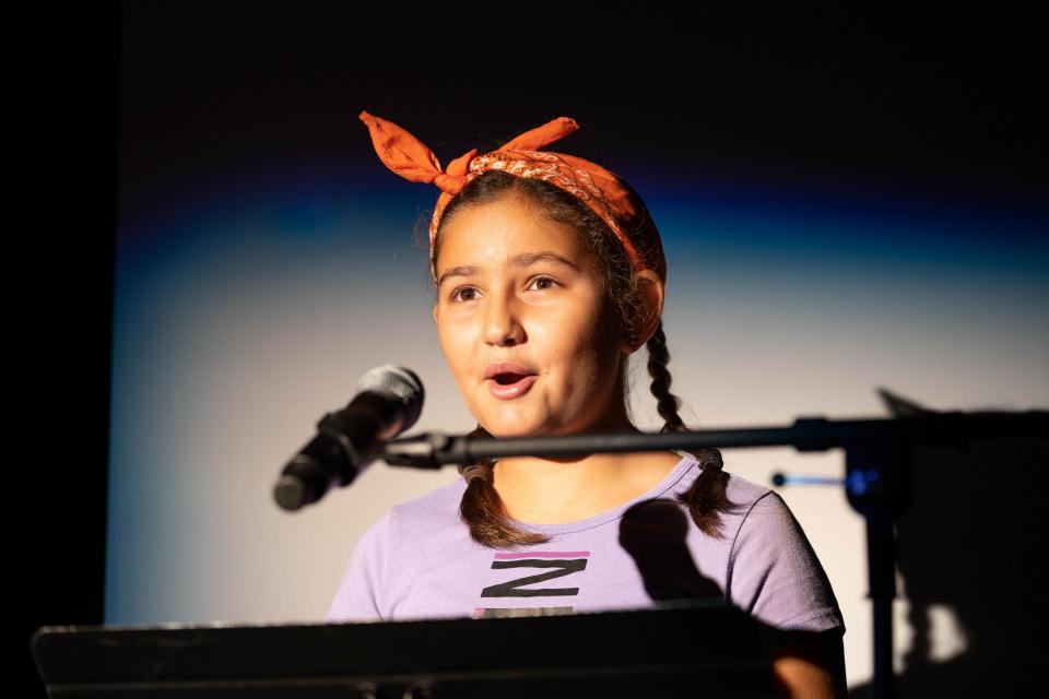 Image of girl at microphone.
