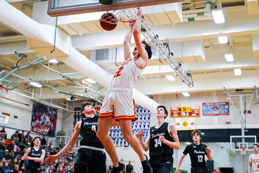 Big man Jack Andre '20 dunks in Jesuit's home basketball game against Ponderosa High School on Friday, Feb. 21.