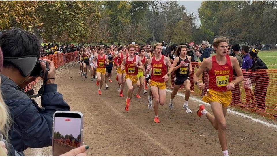 Jesuit Marauders student athletes running on the dirt cross country course