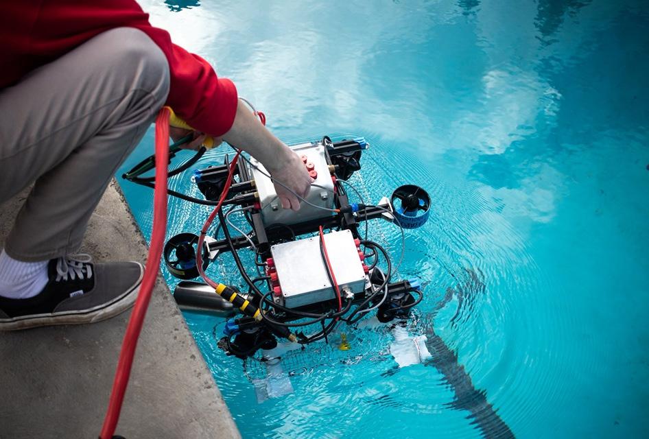 Underwater ROV being dropped into pool
