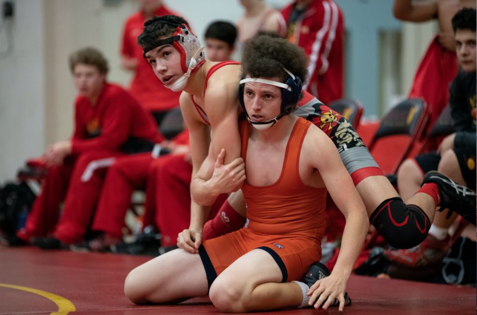 Jesuit High School Wrestler Clark Perry '21, left, wrestles in dual against Cosumnes Oaks High School in Fr. Barry Gymnasium last season.