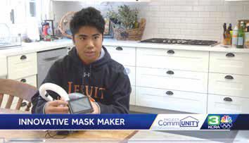 Image of student holding his modified snorkel mask
